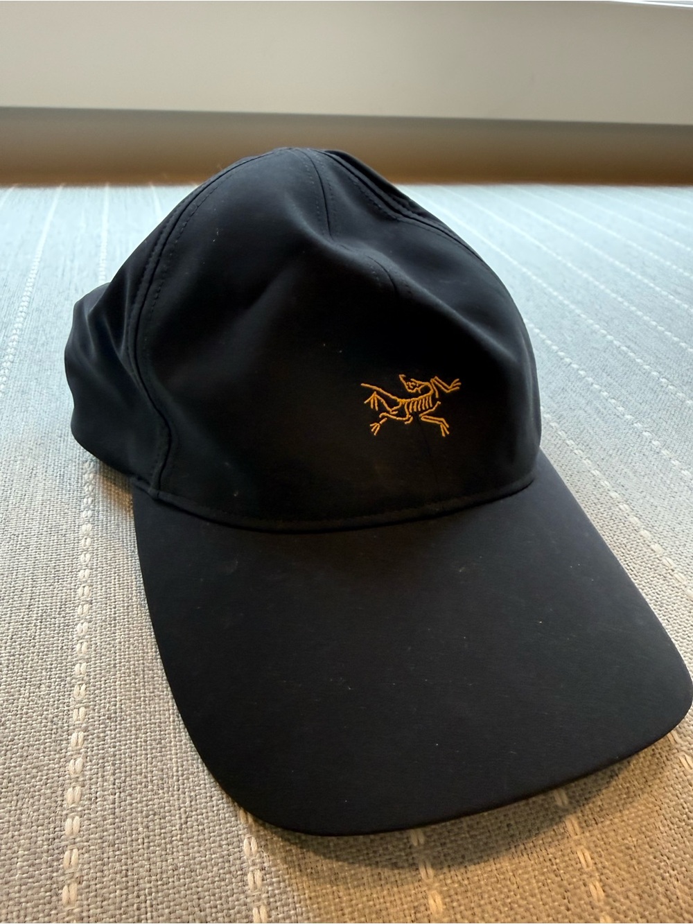 Arc'teryx Black Cap with Gold Embroidered Logo